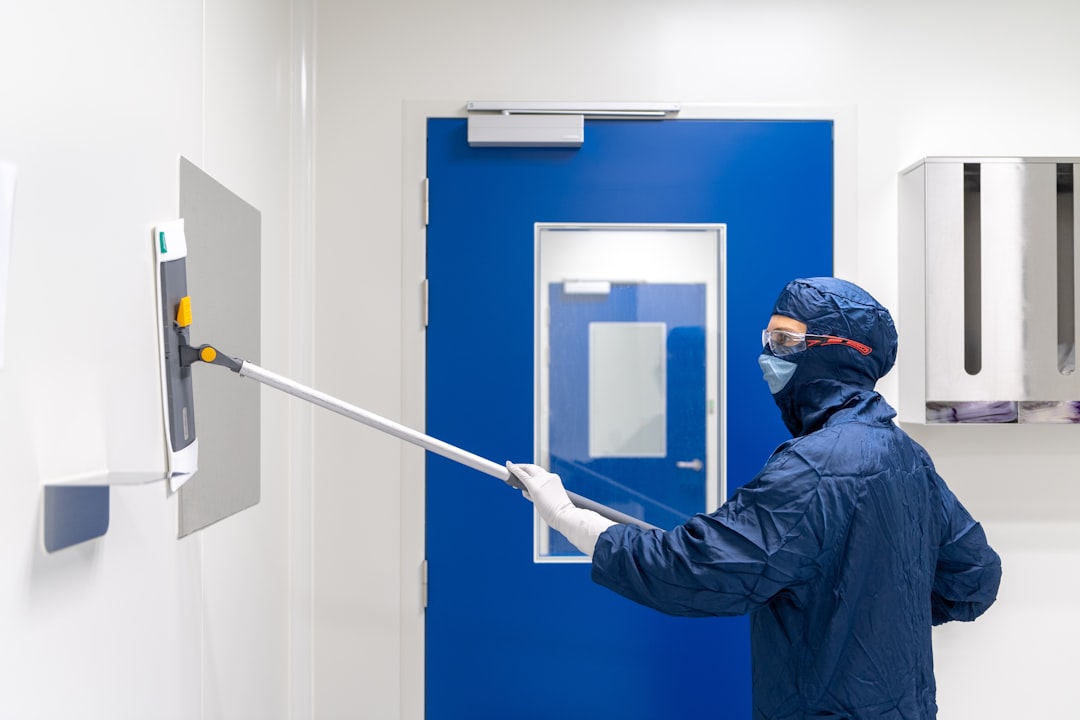 hero-img-02 Cleanroom cleaner, cleaning laboratory wall.