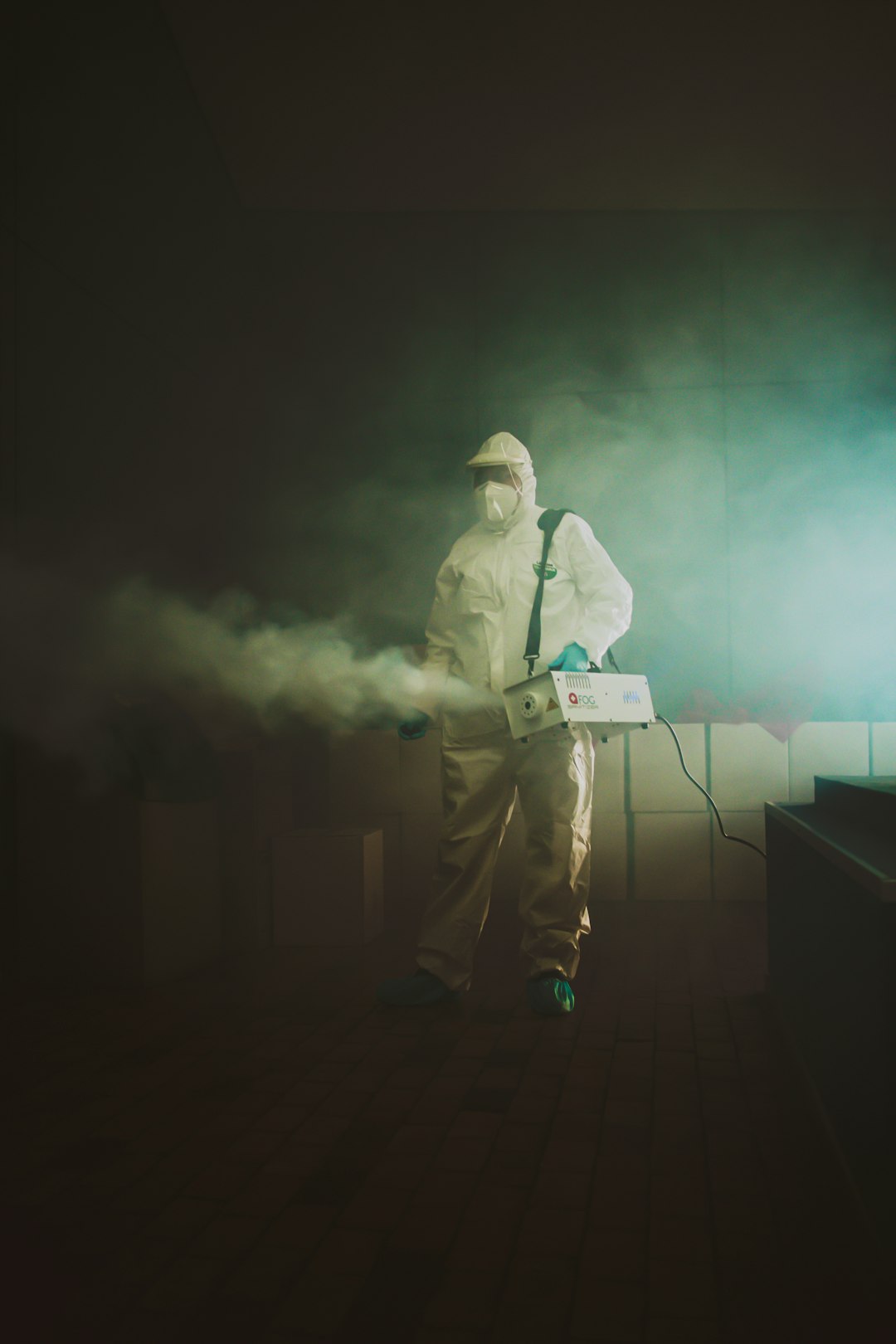 hero-img-01 A woman disinfects an auditorium after being contaminated by Covid-19.